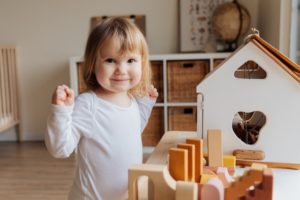 A kid playing in her new room.