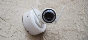 A smart security camera mounted on a wall in a Sammamish Custom Home