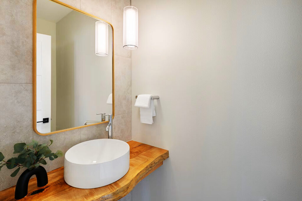 Stunning powder room with a live-edge countertop in Shoreline, wa.