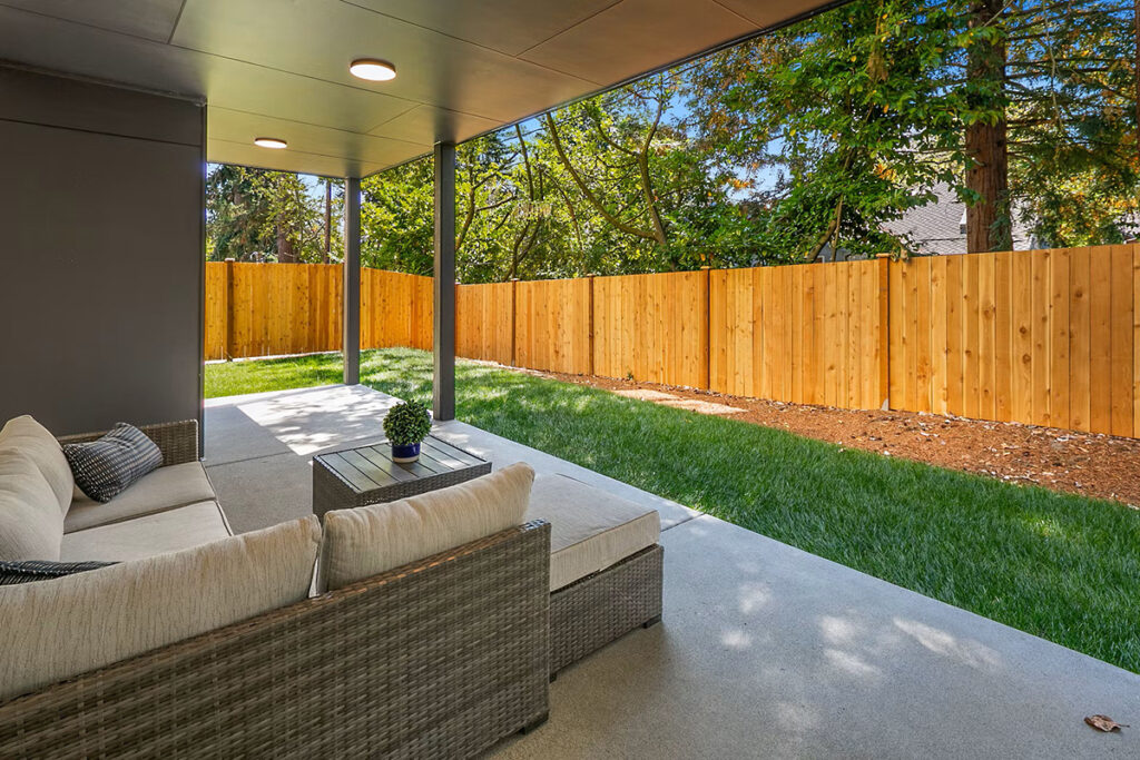 Shoreline home fenced backyard and patio